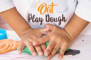 Hands kneading play dough made with oat flour.